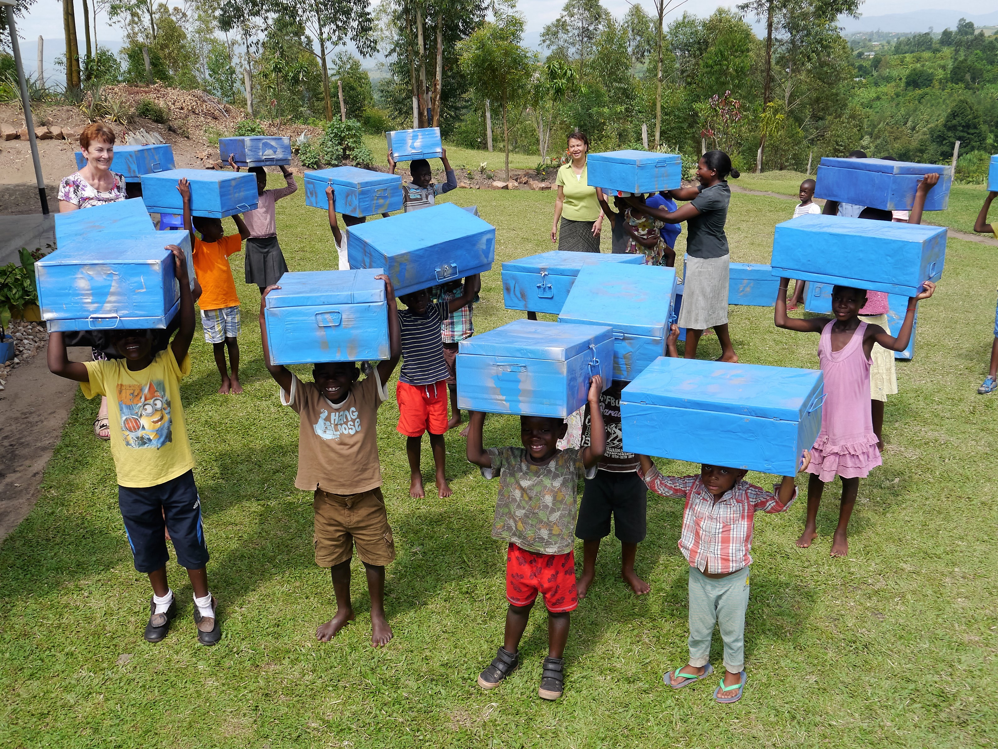 Children excited to receive their own storage box